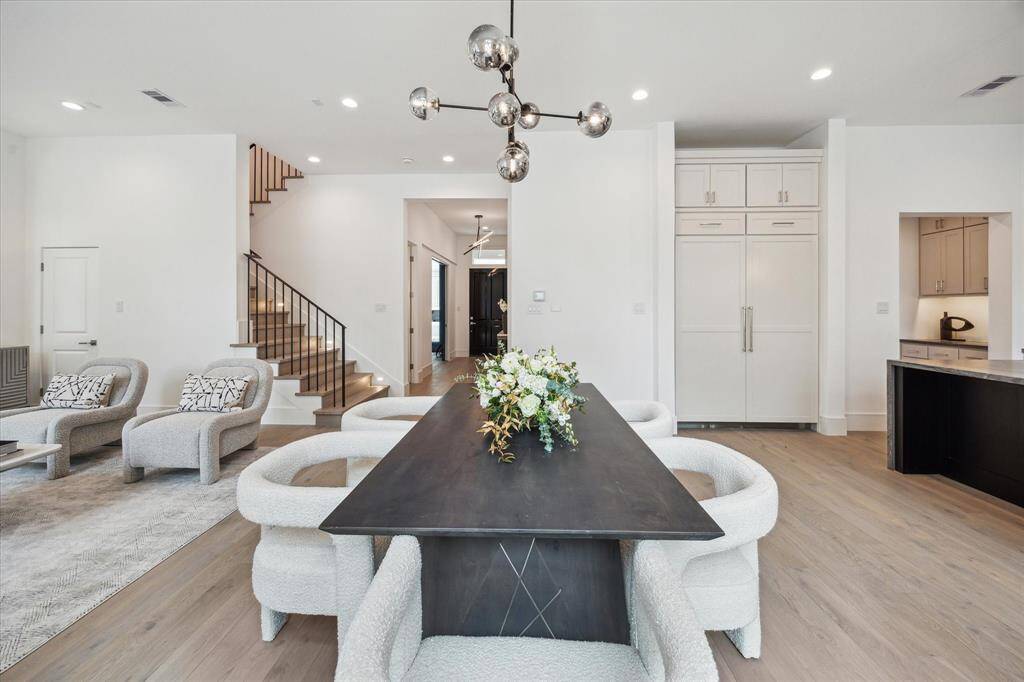 Dining space is located directly off of the living. Ample windows and a set of French doors fill this space with light.