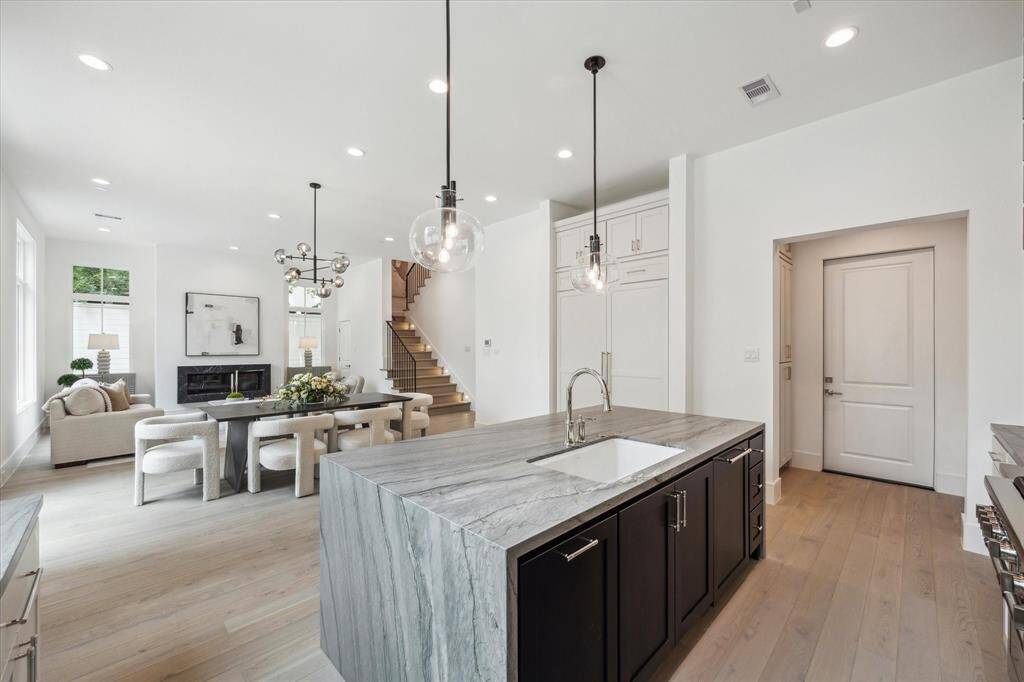 Kitchen features custom Benedettini cabinetry throughout.