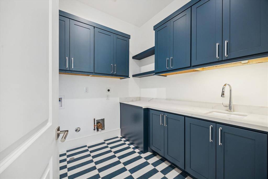 Utility room included on the second floor with plenty of built-in storage, along with Kohler Park Falls enameled cast iron undermount utility sink and Kohler Simplice compact faucet.