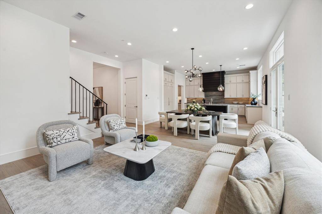 The stunning first floor was designed with relaxation and entertaining in mind! Spacious enough for ample seating surrounding the fireplace, a large dining table, and an island with additional seating that overlooks the living space. Additionally, elevator shaft is off of the living room for future elevator installation, but can be used as large storage closet.