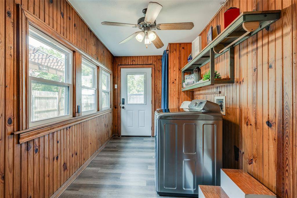 Utility room with washer dryer, storage, clothes hanging rail, shelves for extra storage