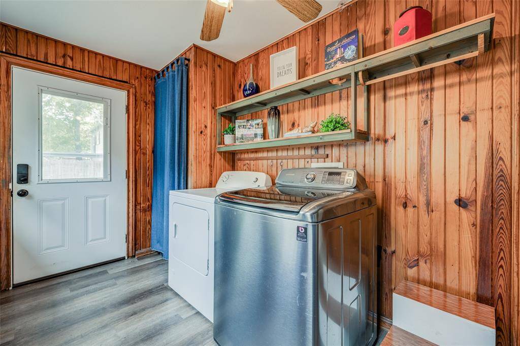 Utility room with washer dryer, storage, clothes hanging rail, shelves for extra storage