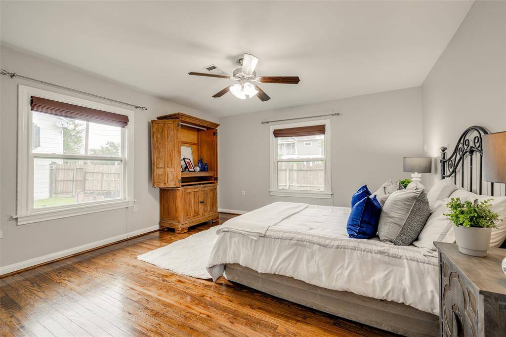 Primary Bedroom to the back of the home, hardwood floors, ensuite bathroom