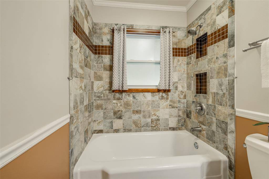 Bathroom 2 - remodeled with granite counter, bath, travertine tile