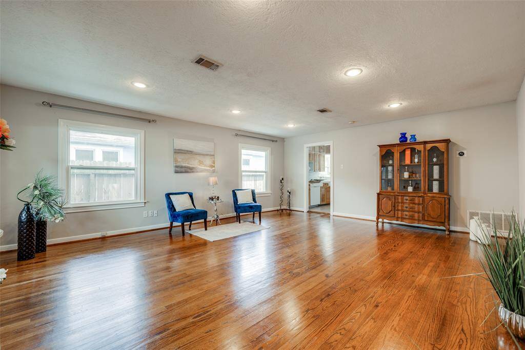 Large Living Room / Dining room with hardwood floors, recessed lights, lots of natural light