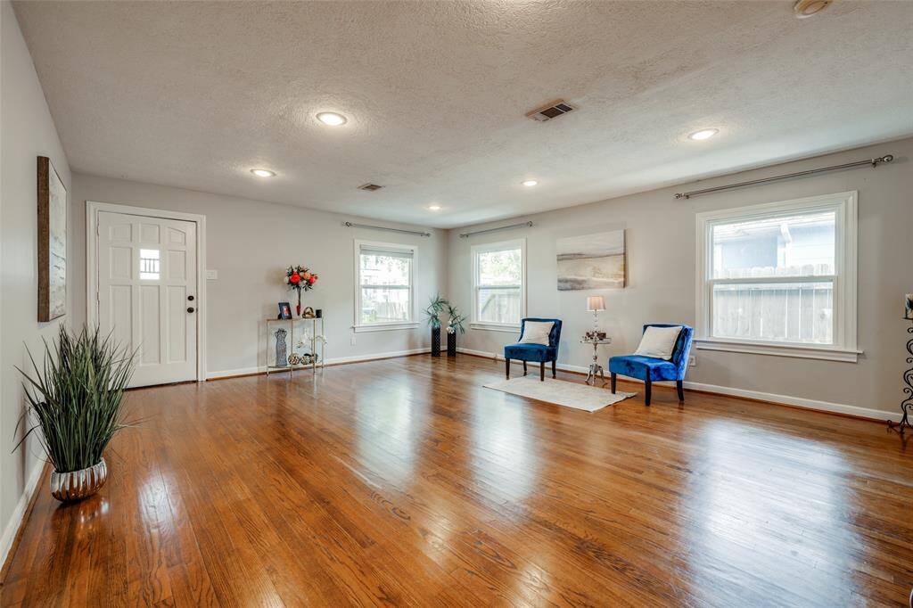 Large Living Room / Dining room with hardwood floors, recessed lights, lots of natural light