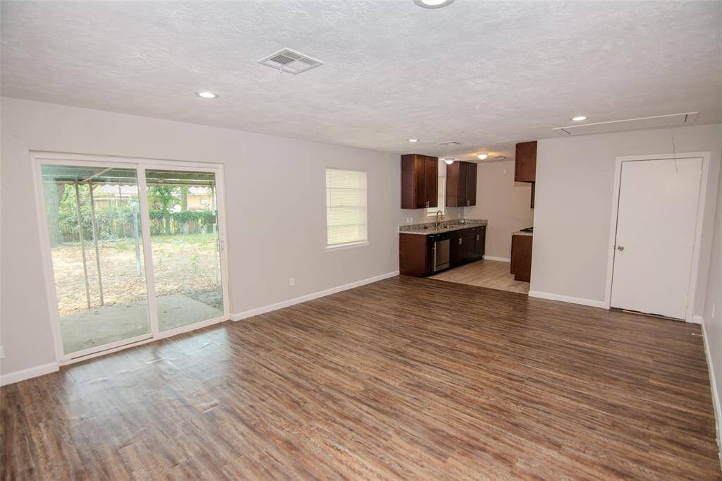 Open Concept Living Room with easy access to the backyard.