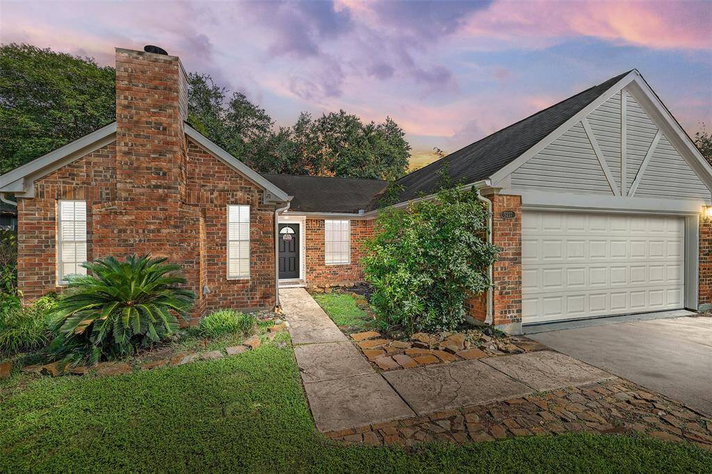 Welcome to 5227 Aberton Ln, where timeless charm and curb appeal come together, showcasing the classic brick design, attached 2-car garage, and established landscaping that frames the home beautifully.
