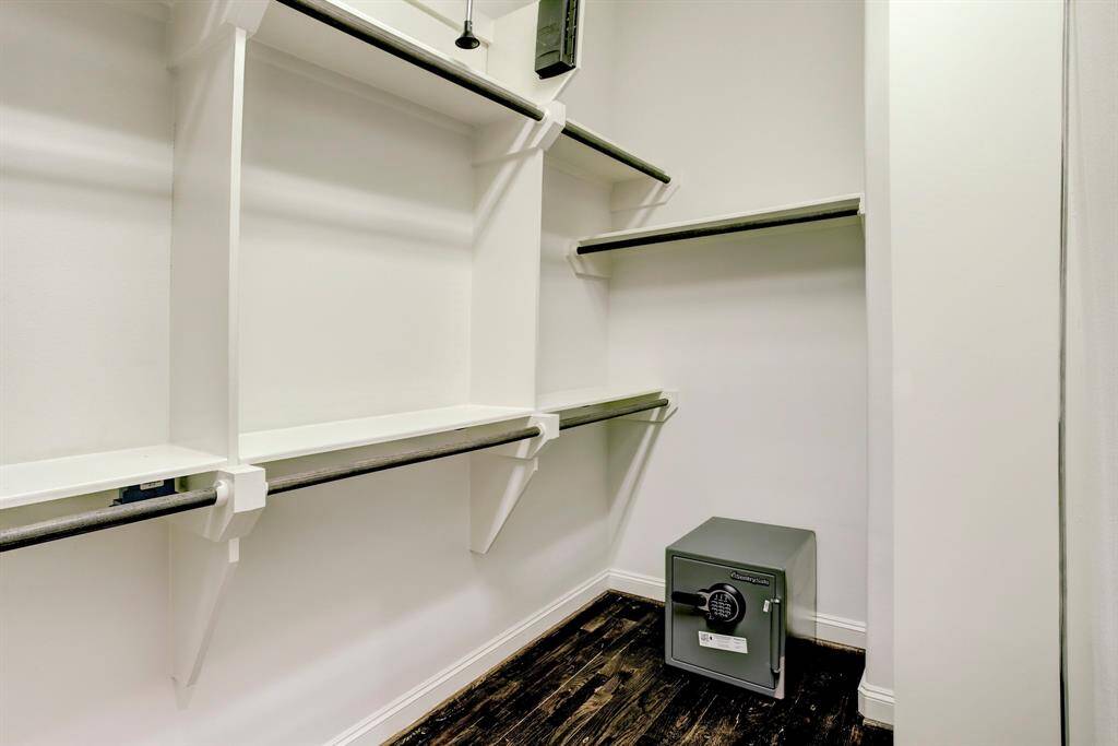 The 1st Primary Closet is spacious and provides lots of clothes hanging space, plus there is a safe for valuables.