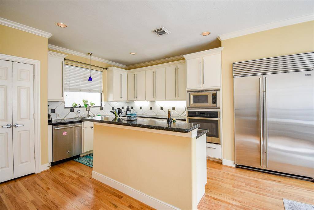 Kitchen is on second floor with generous sub zero refrigerator and ample cabinetry.