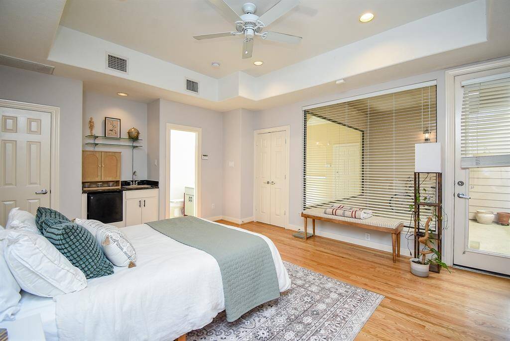 Bedroom overlooks exterior patio and has attached en-suite full bathroom.
