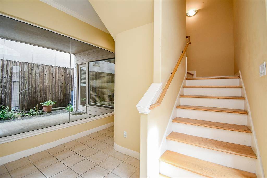 Stairs lead up to second floor living.