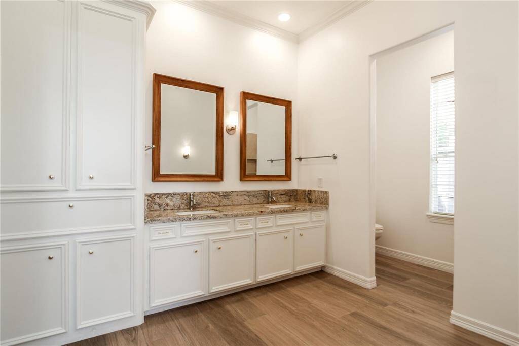 Large Primary Bath with Dual Vanities, Large Linen Closet, Vanity Area and Standing Shower