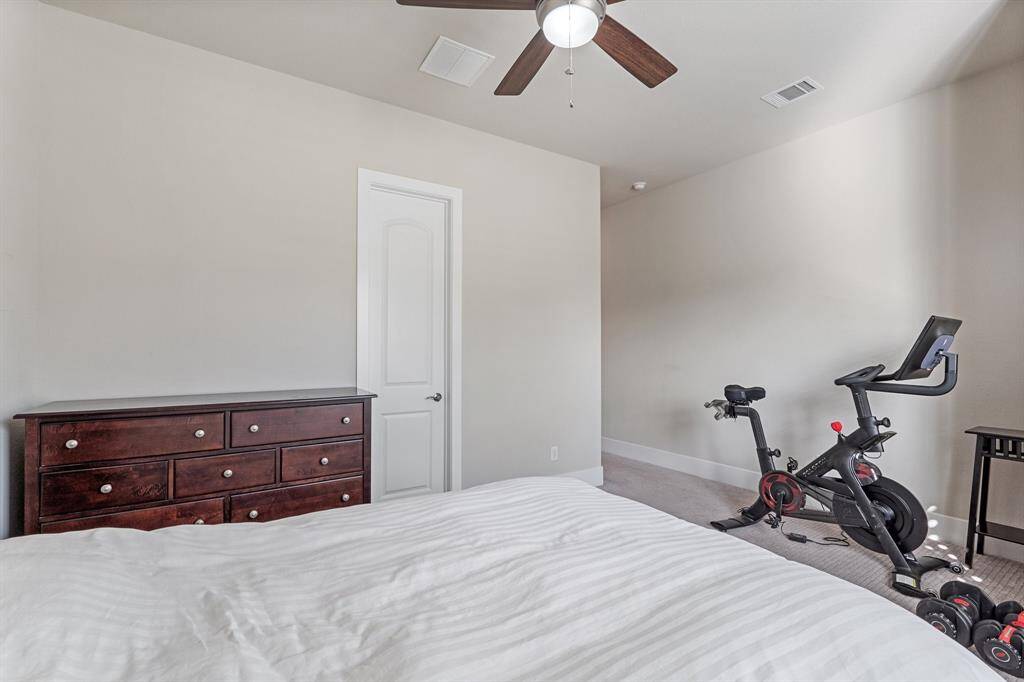 Additional view of the guest suite, offering privacy with an ensuite bathroom. This cozy retreat is perfect for multi-generational living or guests.