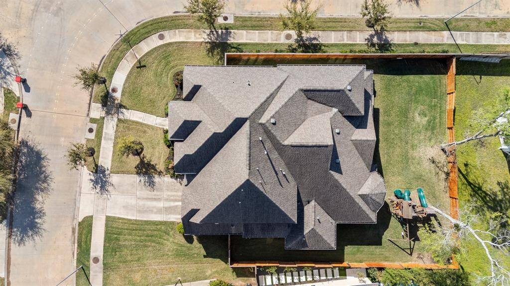 Overhead view showcasing the oversized corner lot which provides ample space and privacy, with a double-wide driveway that adds grandeur and convenience.