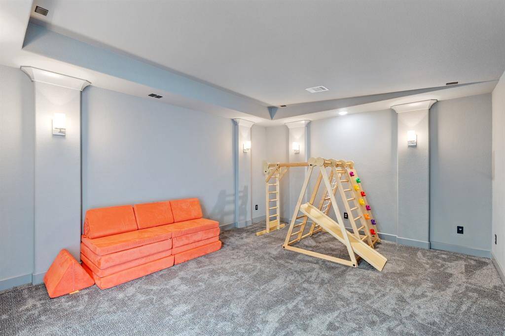 From this angle, you can fully appreciate the thoughtful design of the media room, ready for your favorite films, shows, or games—making it an ideal spot for relaxation and entertainment.