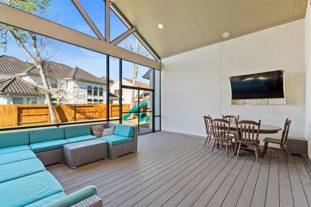Enjoy the outdoors year-round with this spacious screened-in extended covered back patio. Featuring a vaulted ceiling, the space feels open and airy, while offering the perfect spot for relaxation or entertaining. The cozy sitting area is ideal for enjoying morning coffee or evening sunsets, making it a great addition to the home’s living space!