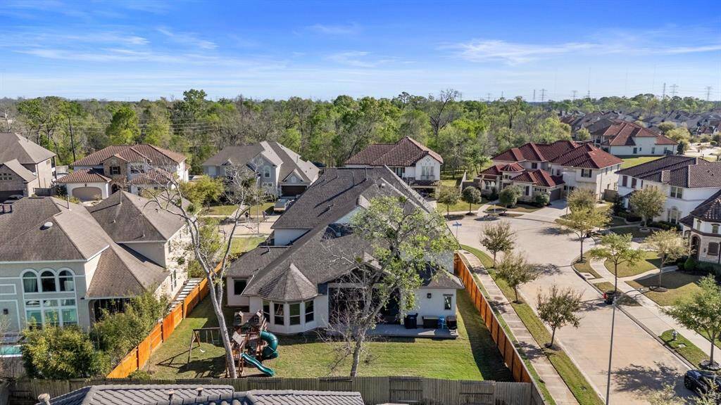 This stunning aerial view showcases the spacious corner lot, offering exceptional privacy and ample room for outdoor activities. The unique corner location also enhances the sense of openness and tranquility!