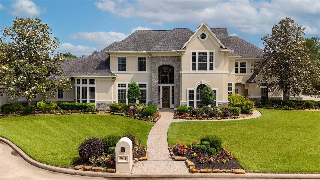 From the moment you arrive, this home makes a statement. A brick-enclosed mailbox adds a touch of charm and cohesion, while the grand walkway guides you through beautifully manicured landscaping to the stately front entrance — the perfect prelude to what awaits inside.