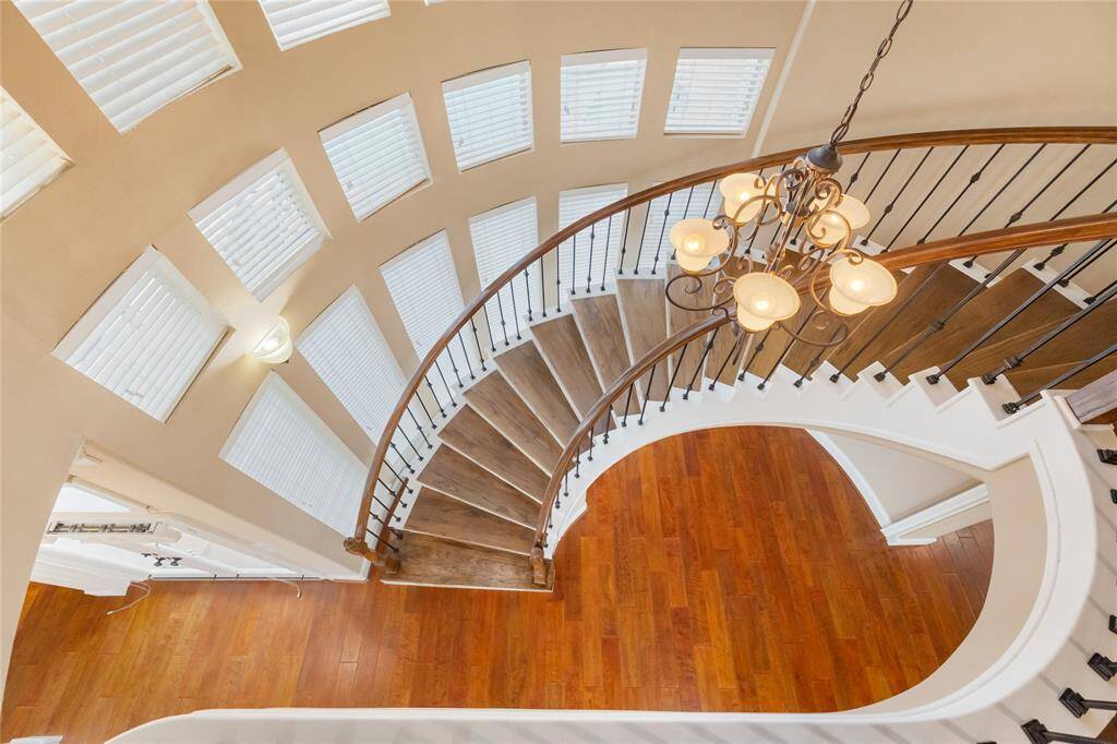 Whether greeting guests or simply heading upstairs, the staircase offers a dramatic yet inviting focal point — the kind that turns ordinary moments into something memorable. Its open layout allows for clear sightlines across the home, adding flow and dimension to every gathering.