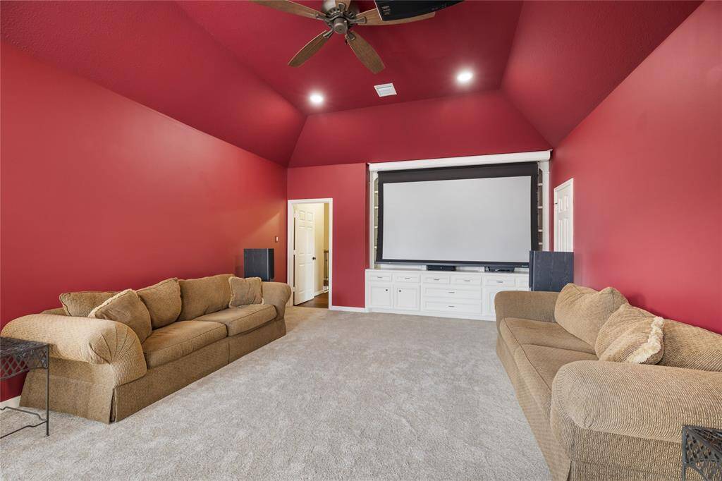 Movie nights take center stage in the dedicated media room, complete with projector and theatre-style ambiance, complete with projector, surround sound, and subwoofer all updated in 2022.