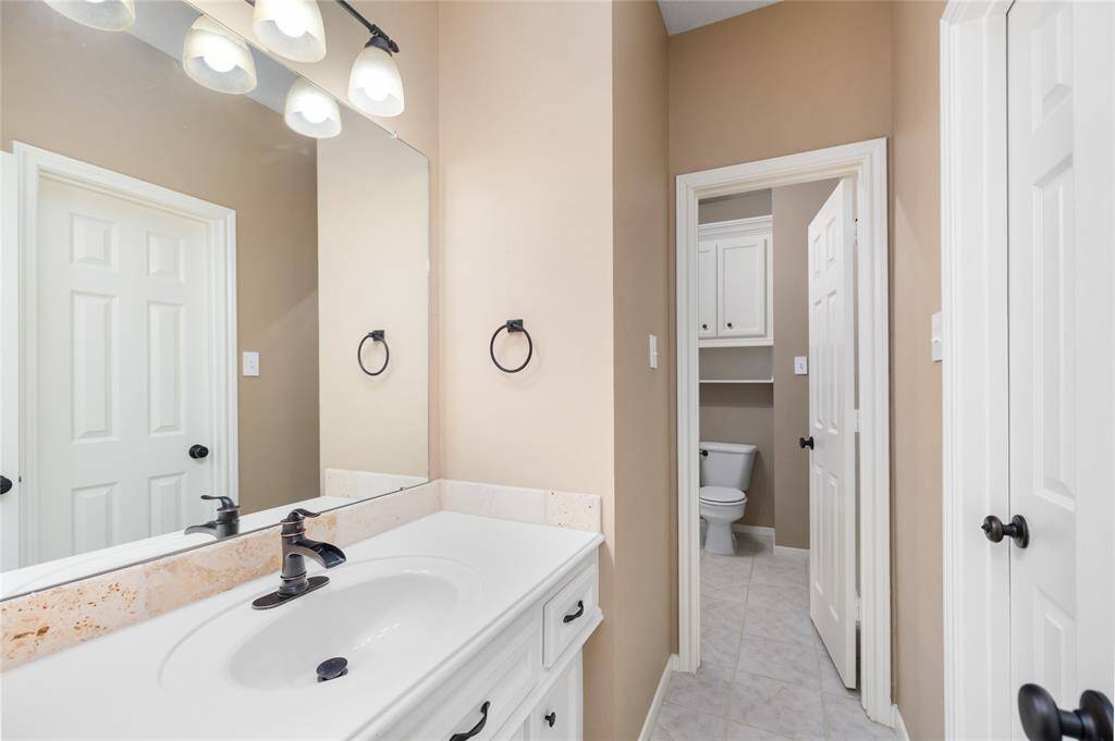 Thoughtfully designed with custom cabinetry and crisp white countertops, this secondary bath combines function with style. Freshly painted in 2024 and finished with clean, modern touches, it’s a welcoming space ideal for guests or everyday family use.