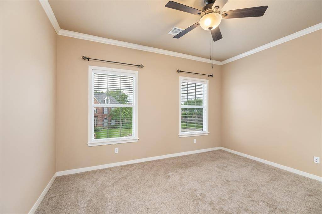The secondary bedrooms are designed with both style and comfort in mind. Fresh paint (2024) and updated carpet (2023) provide a move-in-ready feel, while large windows let in beautiful natural light. Whether used for restful nights or creative spaces, each room feels like its own private haven.