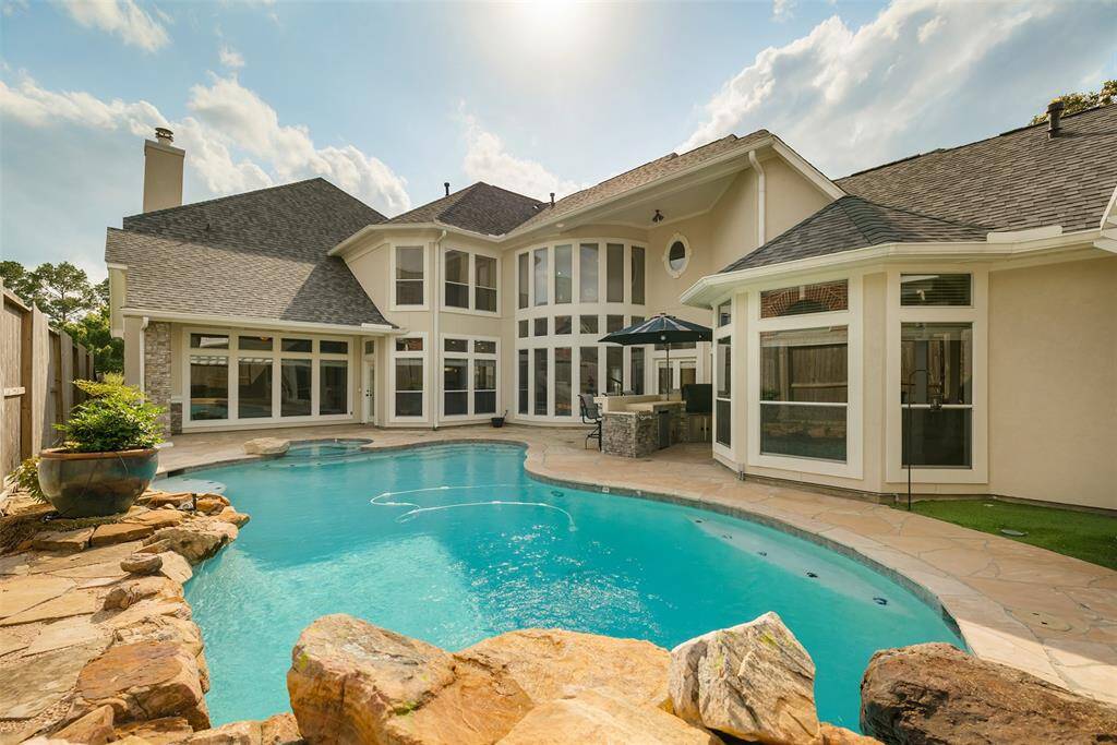 Whether you're diving in for an afternoon swim, enjoying dinner under the covered area, or soaking in the peaceful ambiance by the water, this outdoor space is built for relaxation, connection, and year-round enjoyment.