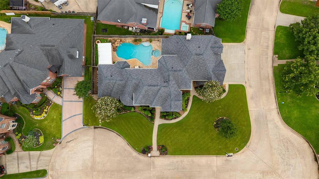 From above, the thoughtful design of this home truly shines. The layout is expansive yet balanced, offering a harmonious blend of grandeur and functionality — a testament to the care and planning poured into every square foot.