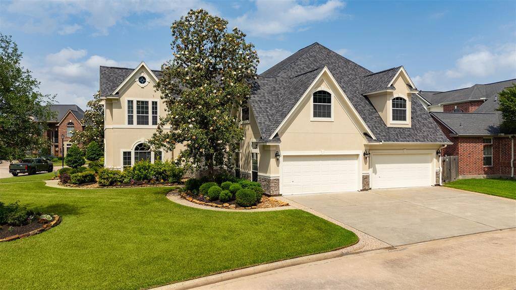 An expansive 4-car garage sits along the side of the home — ideal for car enthusiasts, extra storage, or even a home gym or workshop. The space, accessibility, and versatility are unmatched.