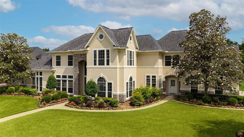 This home’s facade stuns from every angle. A combination of stone, stucco, and elegant architectural lines is enhanced by lush, meticulously maintained landscaping that adds warmth and curb appeal all year long.