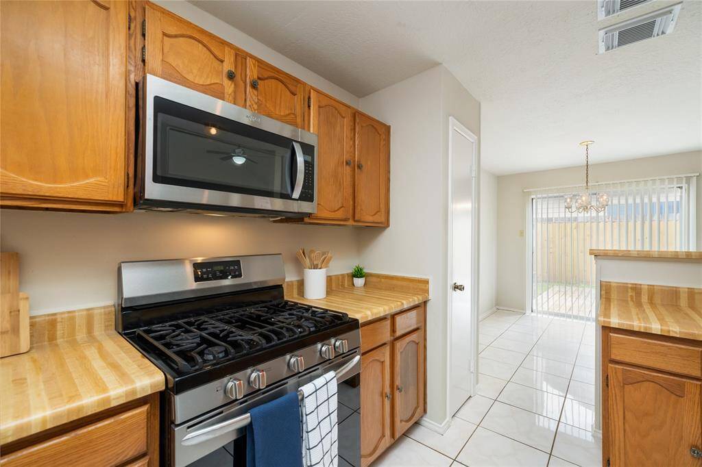 Come and imagine yourself cooking in this kitchen and using the convenient built-in microwave and gas range stove.