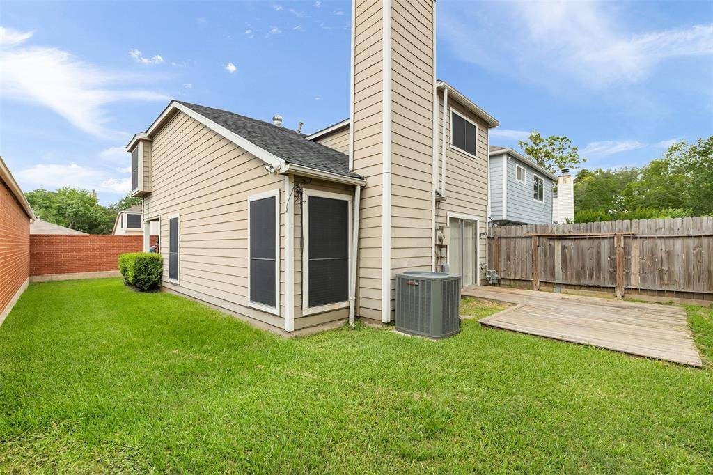 The yard is fully fenced and wraps around the home.