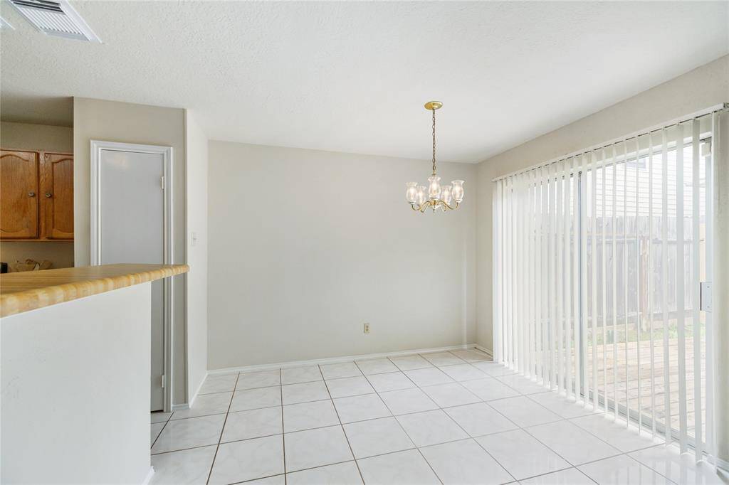 The kitchen is open to the dining area.