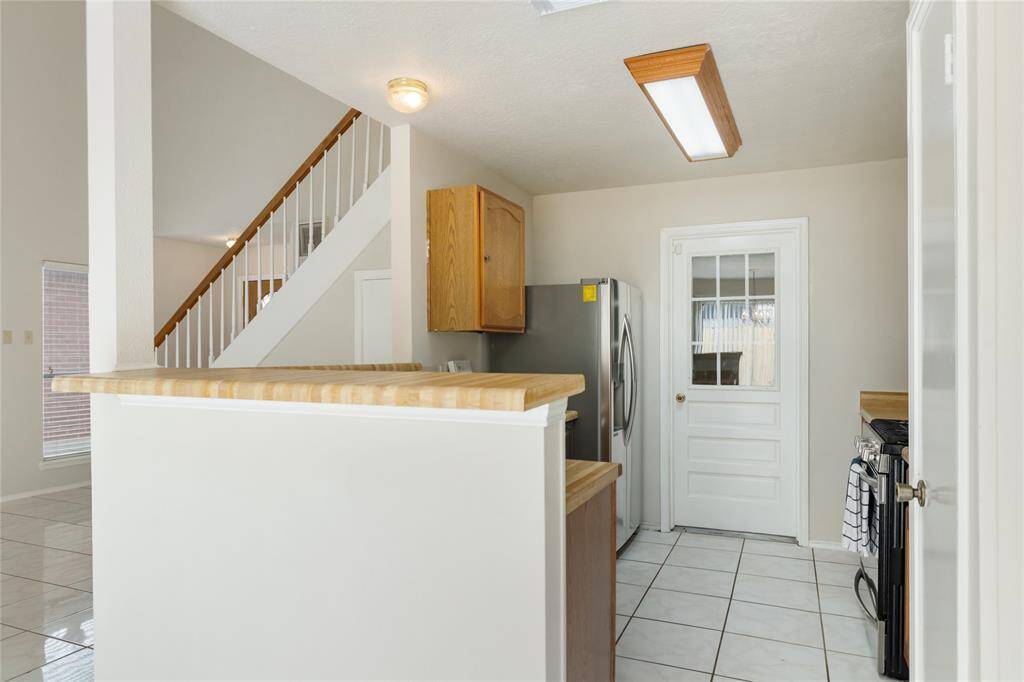 View into the kitchen from the dining area.
