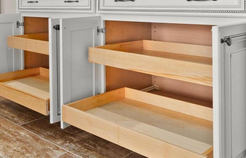 Kitchen cabinets feature pull-out wooden shelves in ALL lower cabinets, perfect for pots, pans, cutting boards and offers convenient storage solutions.