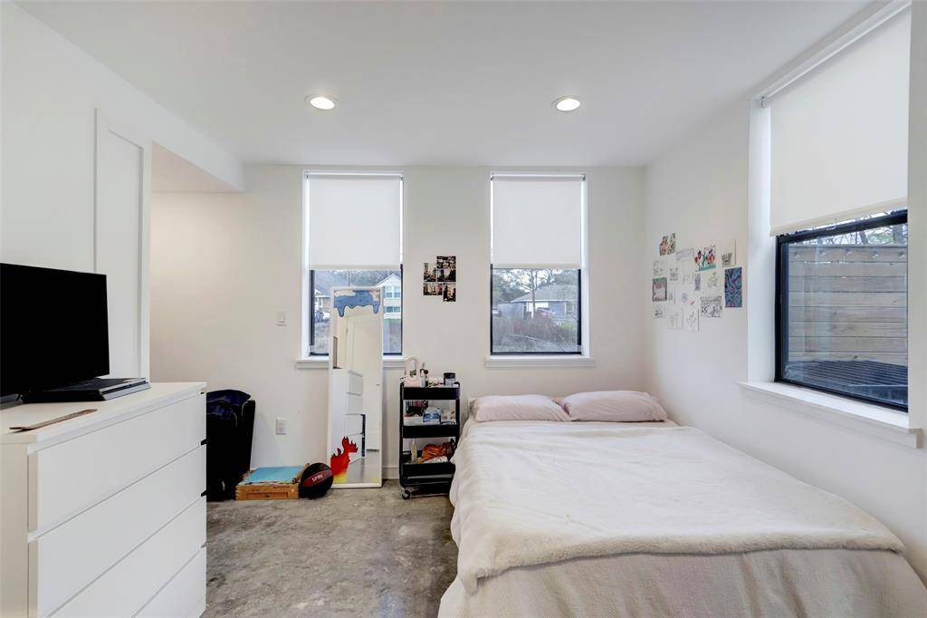 Bedroom has an open-concept closet for convenience.
