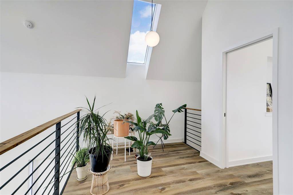 Nook in the loft area sits below a beautiful skylight.