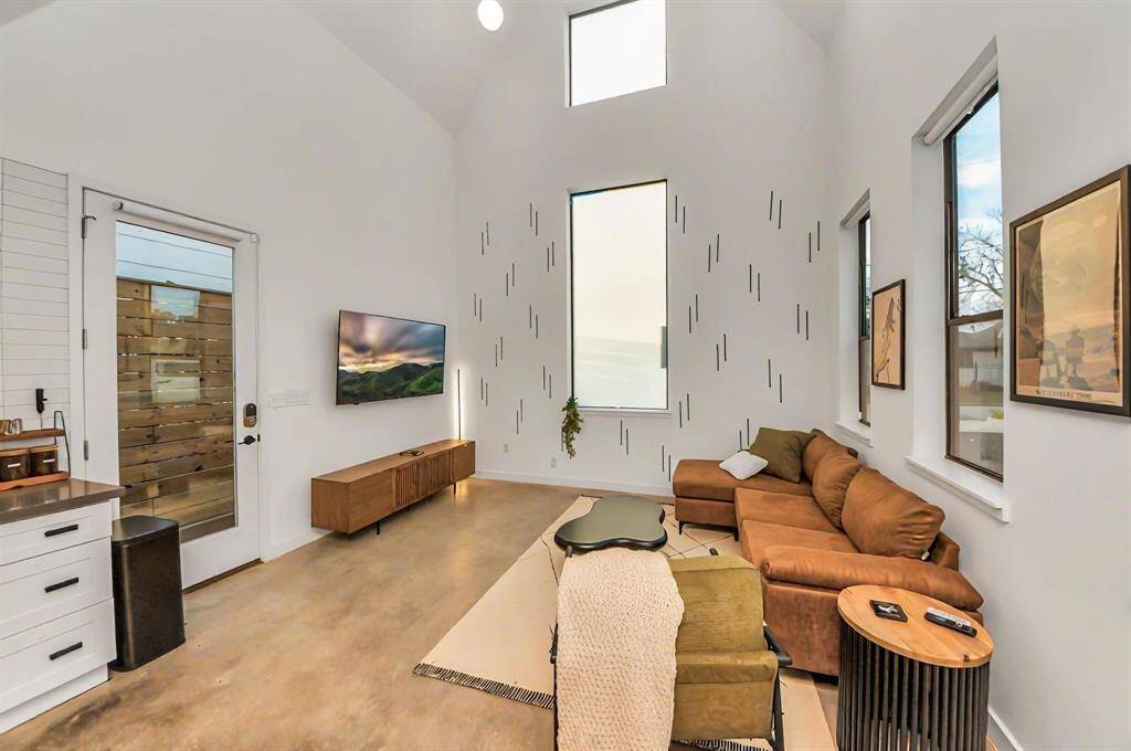 Sky-high windows with pull down shades provide privacy while allowing plenty of natural light in.