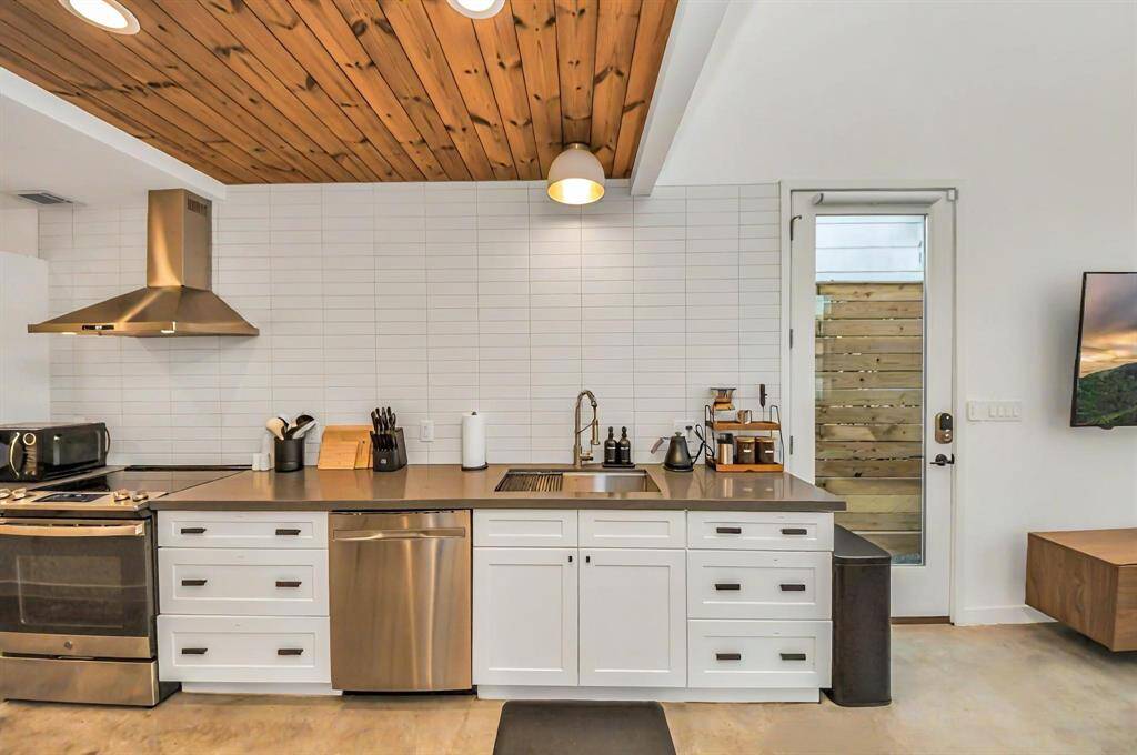 Another perspective of the kitchen with view of the customized storage.