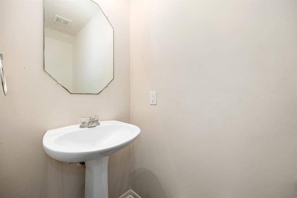 A convenient half bath is located on the main floor