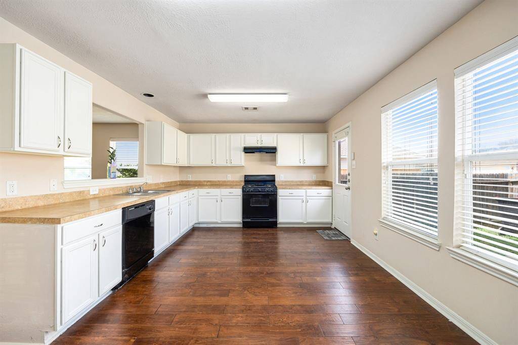 The kitchen features a practical layout with the cooktop and sink positioned for smooth, efficient workflow.