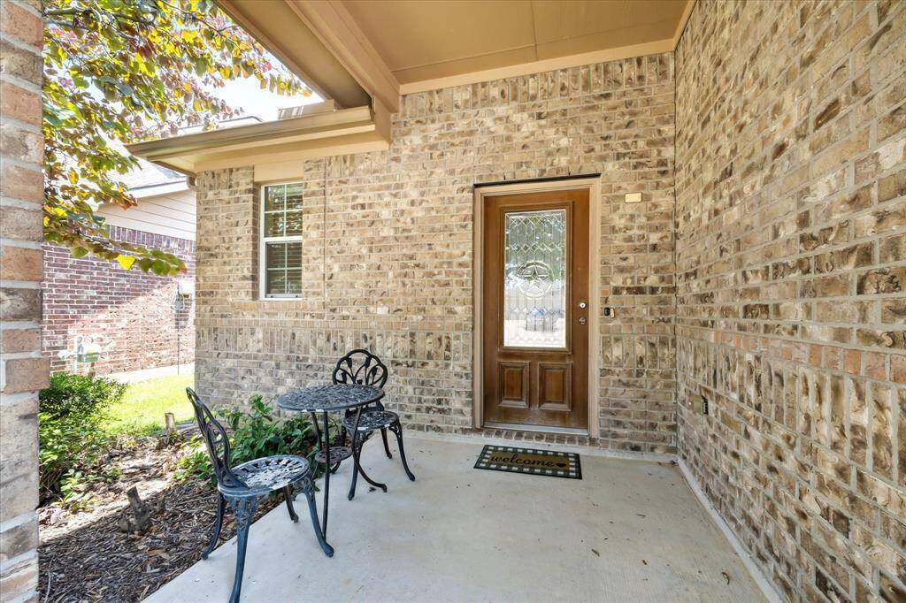 Adorable front porch, with leaded glass front door and plenty of room to relax.
