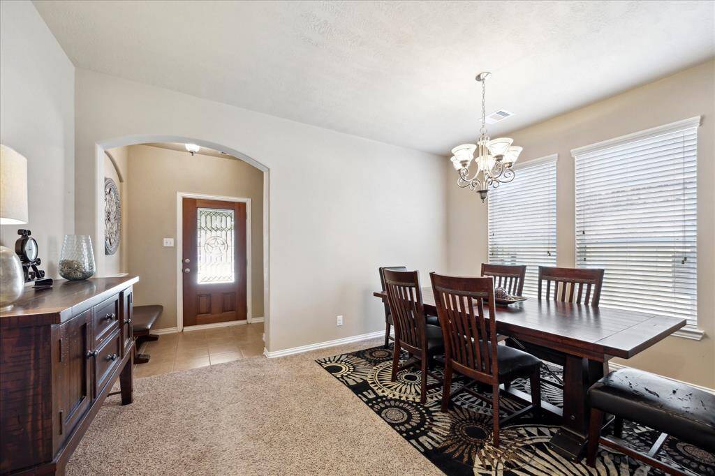 Formal dining room with large windwos for abundance of light. Could also easily be used as a study if a formal dining room is not needed.