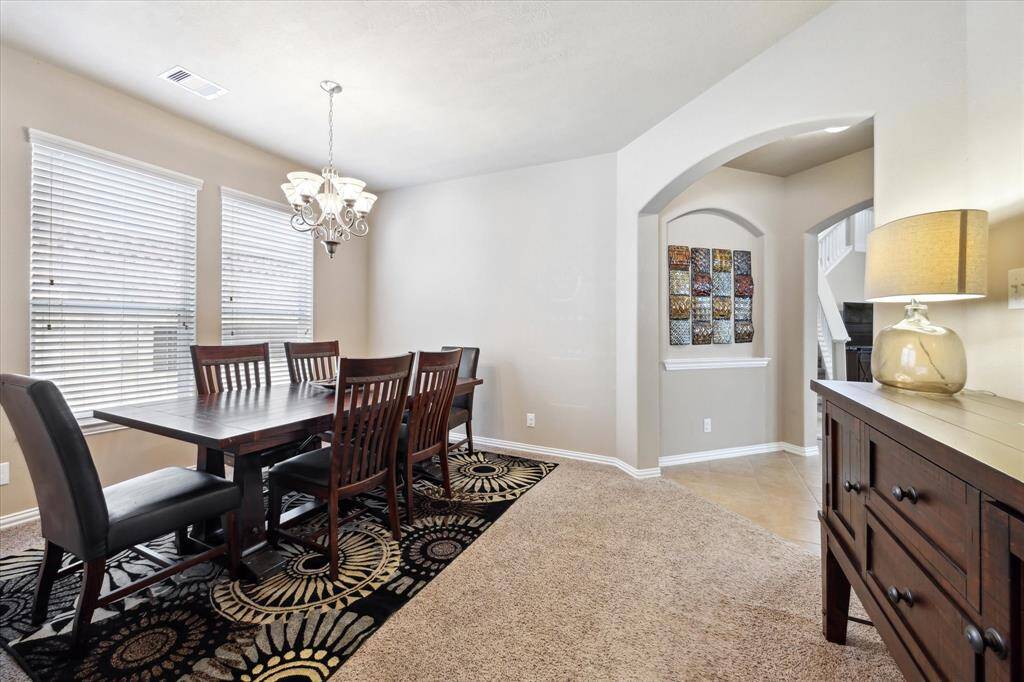 Another view of the dining room, and the opening to the kitchen and family room.  Large space that can be used for whatever your needs are.