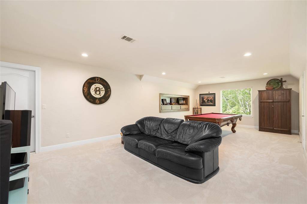 This spacious upstairs flex area offers limitless potential—perfect as a game room, second living area, or whatever best suits your lifestyle. With its open layout and elevated placement, it’s a versatile retreat within the home.