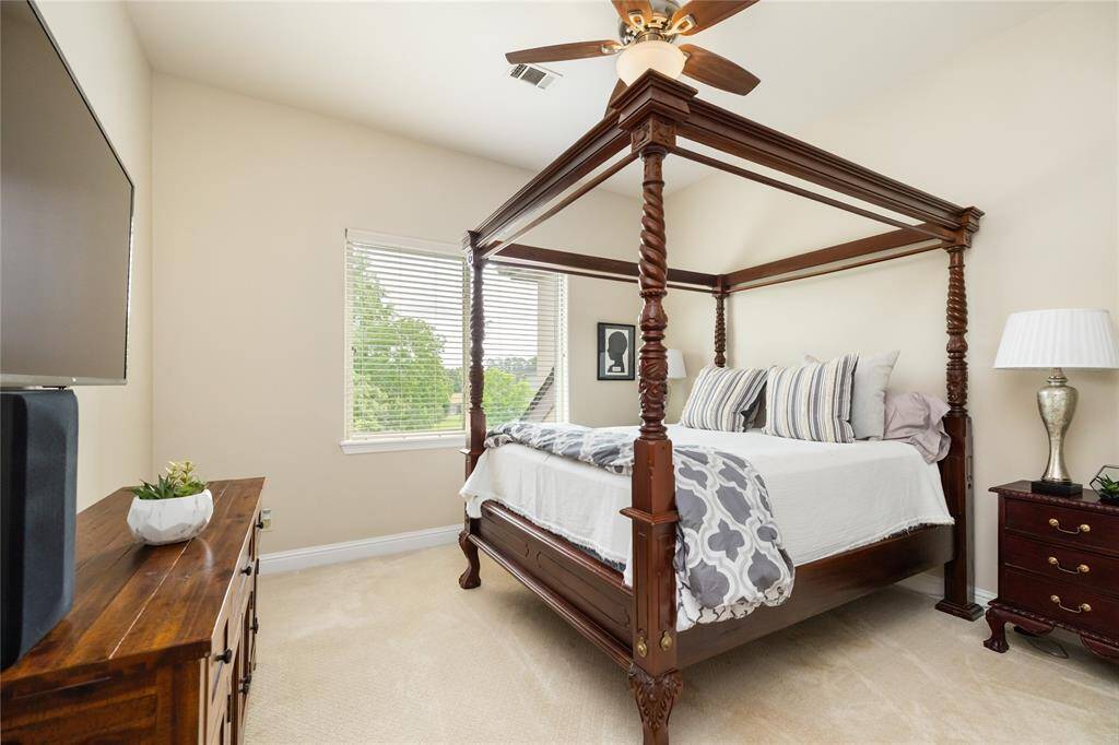 Designed with an eye for elegance, this secondary bedroom stands out with its generous proportions, refined finishes, and elevated ceiling—making it more than just a bedroom, but a truly inviting retreat.