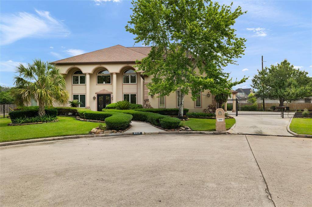 Nestled on a quiet cul-de-sac, this gated driveway offers both privacy and prestige, welcoming you into a serene and secure estate setting.