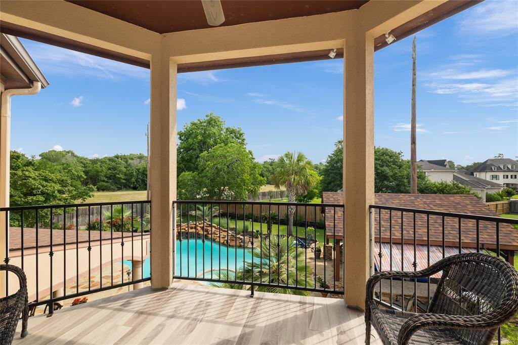 From the second-floor balcony, take in serene views of the pool below—your own secluded sanctuary. The peaceful rhythm of the waterfall and the privacy of the setting create an atmosphere of everyday luxury.