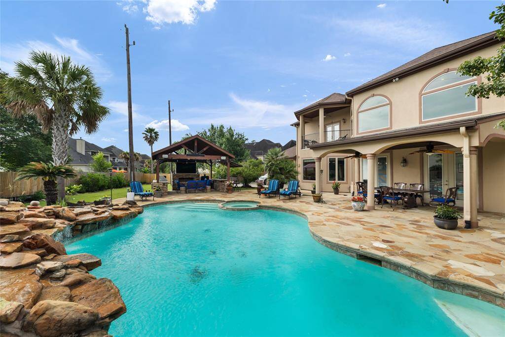 Imagine your day-to-day feeling like a luxury getaway. With a covered patio, outdoor kitchen, and resort-style pool just steps away, this backyard is designed to turn everyday moments into relaxing escapes—perfect for entertaining or simply enjoying the quiet comforts of home.